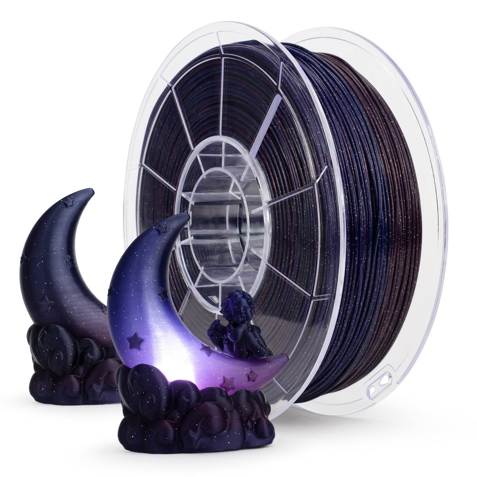 Spool of black filament with decorative moon and star figurine on a white background